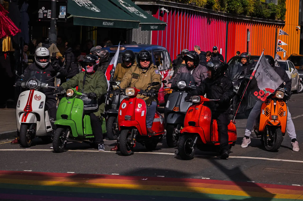 Colourful scooters stopped at the lights